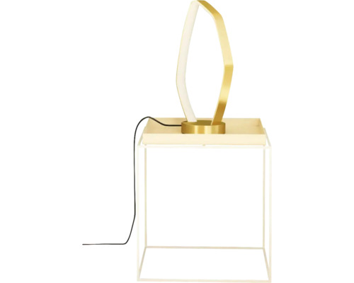 Lampă de masă decorativă din metal pe o măsuță laterală