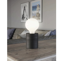 Lampă de masă decorativă cu abajur rotund luminos și bază din lemn închis la culoare pe o masă
