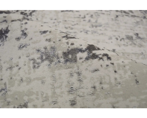 Prim-plan al unui covor cu model abstract