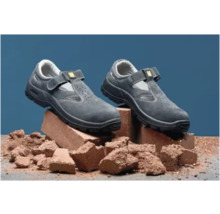 Pereche de pantofi de protecție gri cu închidere Velcro pe cărămizi