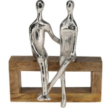 Sculptură decorativă cu două figurine așezate pe o bancă din lemn