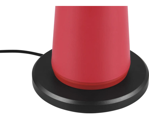 Prim-plan cu o lampă de masă roșie cu bază neagră