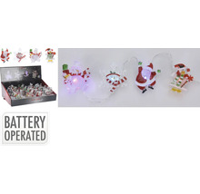 Șir luminos cu baterii cu figurine de Crăciun, cum ar fi oameni de zăpadă și Moși Crăciun într-un ambalaj de vânzare