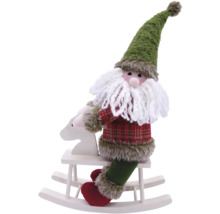 Spiriduș de Crăciun pe un cal balansoar ca decorație