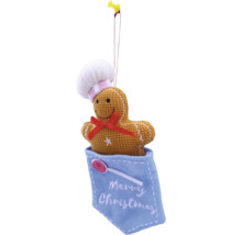 Om de turtă dulce ca decorație de Crăciun cu bonetă de bucătar și fundă