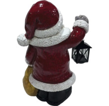 Figurină Moș Crăciun cu lanternă și sac în spate