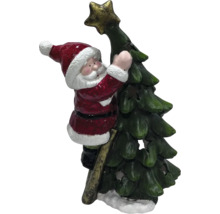 Figurină decorativă Moș Crăciun urcând pe o scară pentru a decora un pom de Crăciun cu o stea