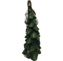 Figurină Moș Crăciun îmbrățișând un pom de Crăciun