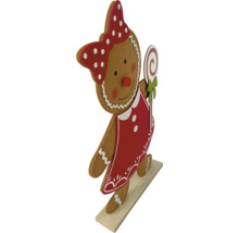 Femeie de turtă dulce din lemn cu fundă și acadea ca decorație de Crăciun