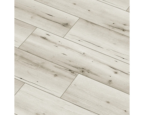 Pardoseală laminată deschisă la culoare în model herringbone