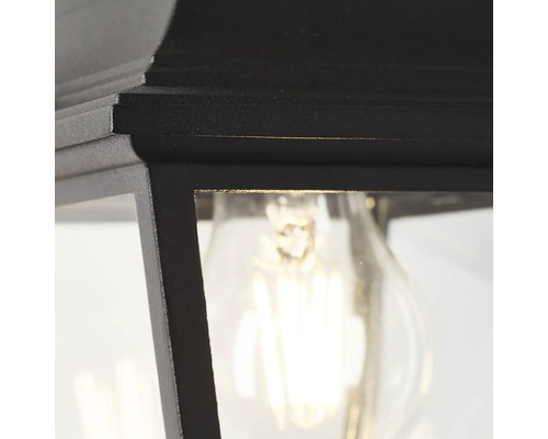 Imagine detaliată a unei lămpi de exterior negre cu bec.