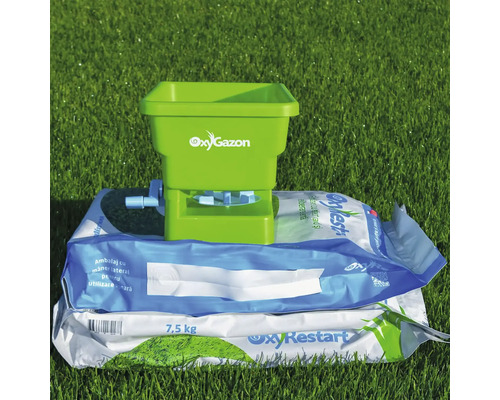 Distribuitor de îngrășăminte pe pachetul de semințe de gazon