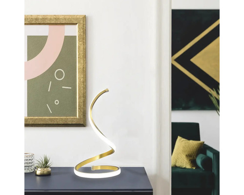 Lampă de masă decorativă în spirală pe o masă