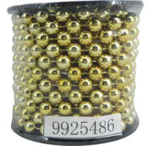 Șirag de mărgele aurii în recipient