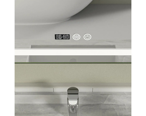 Detaliu al unei oglinzi de baie cu afișaj digital și comenzi pentru iluminare și încălzire.