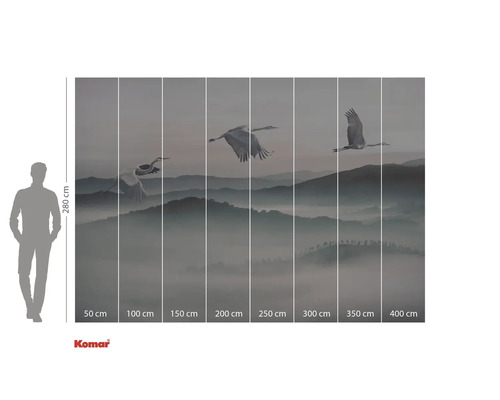 Fototapet cu cocori în zbor deasupra unui peisaj muntos